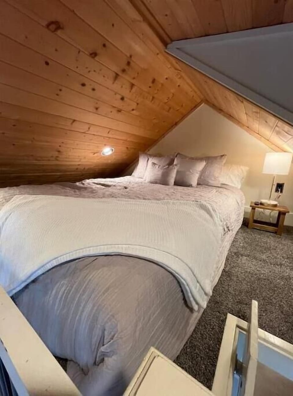 Cozy lofted bed. Sink into this premium queen mattress with extra pillows! 