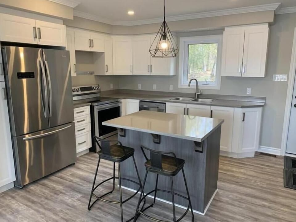 Beautiful and modern kitchen, island with barstools