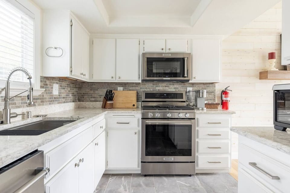 Fully furnished kitchen. Ready to make your culinary and hosting dreams come true!  Includes pots, pans, a variety of spices and condiments, Ninja blender, baking sheets, cooking utensils, cooking knives, an Instant Pot, and more!