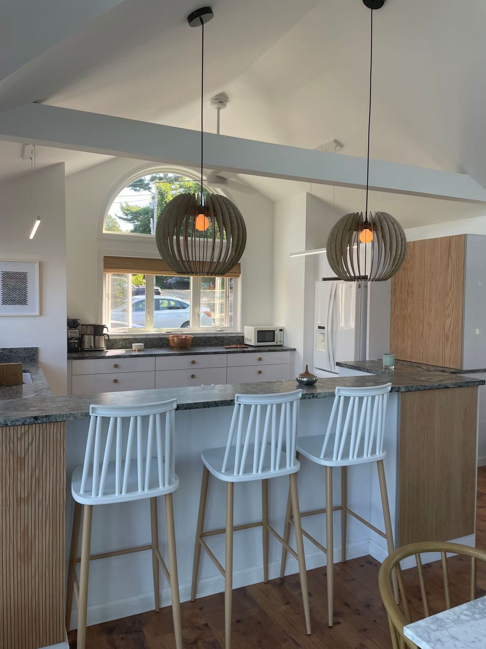 Beautiful kitchen with bar stools.