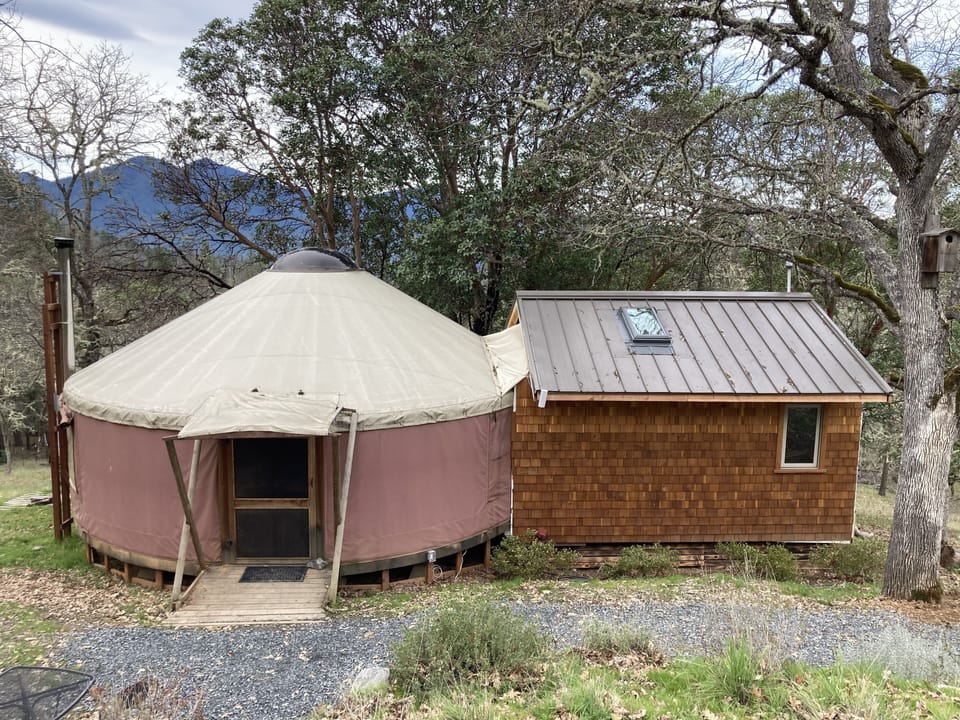 Front of yurt w/ attached kitchen and bathroom space 