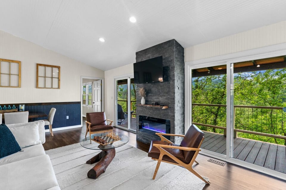 Get cozy on the couch, enjoy the fire and mountain views