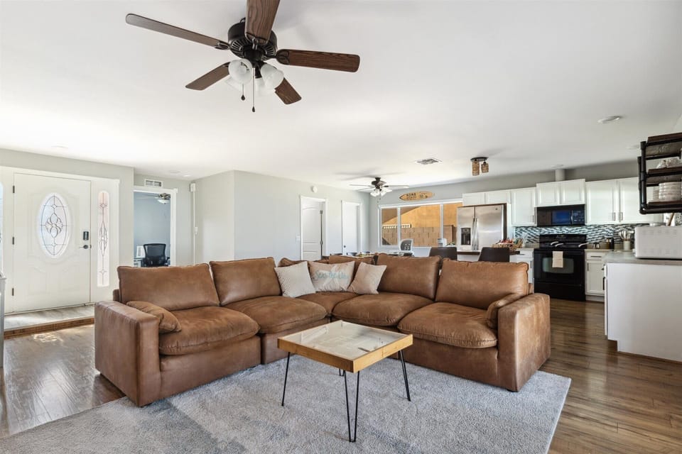 A roomy open-concept kitchen and living area provides plenty of space to gather and entertain.