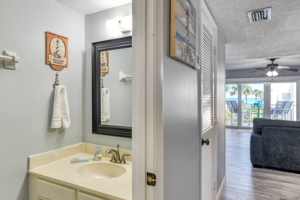 There is a half bathroom downstairs near the living area.