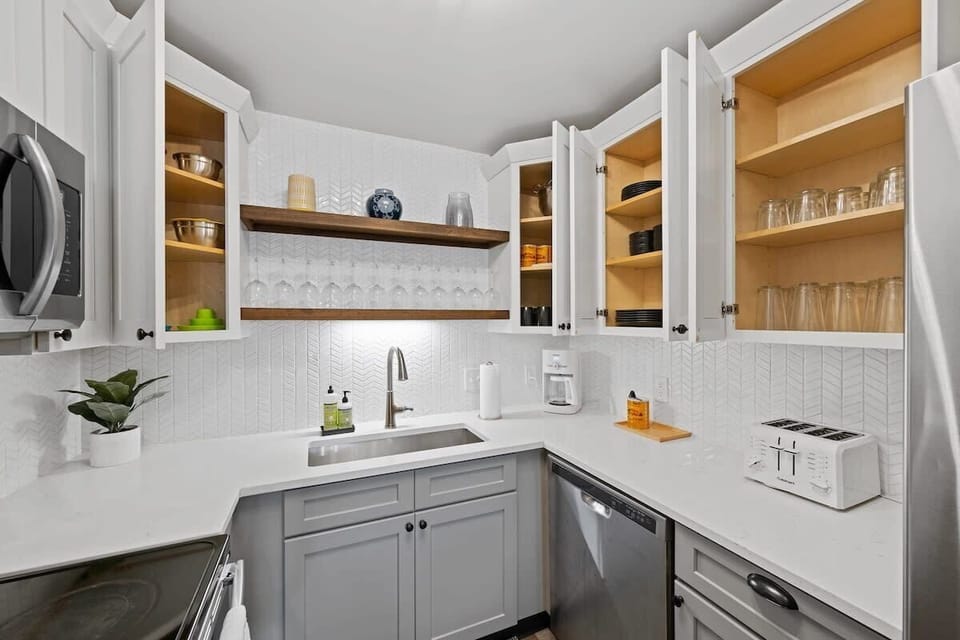 Step into this cozy kitchen with a sleek sink, a handy microwave, and a reliable dishwasher. The perfect space to whip up your favorite meals!  #KitchenGoals #HomeCooking #ApplianceLove
