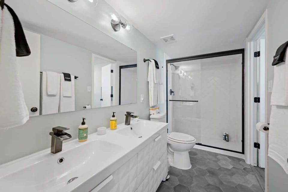 Experience the ultimate comfort in this well-equipped bathroom equipped with a functional toilet, elegant sink, and rejuvenating shower  #HomeSpa #ModernLiving #LuxuryBathroom