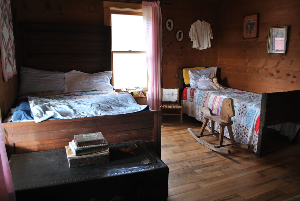 1890s 3/4 full bed with historic child's bed alongside