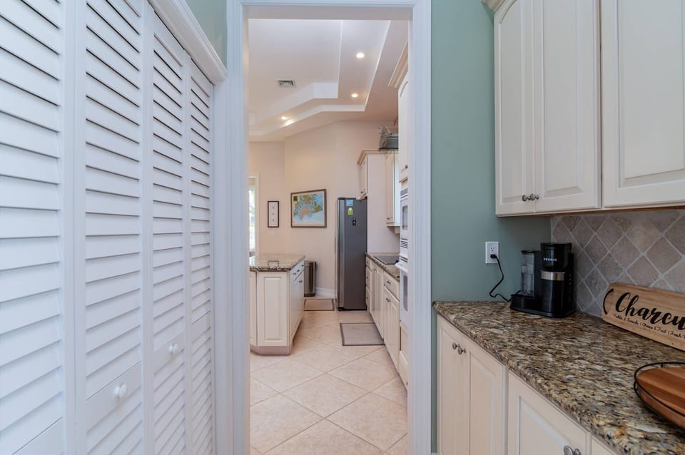 Pantry, coffee and wine station with view of the kitchen 