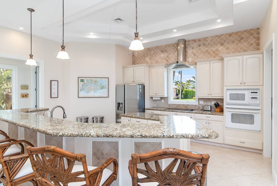 Kitchen and views of palm trees 