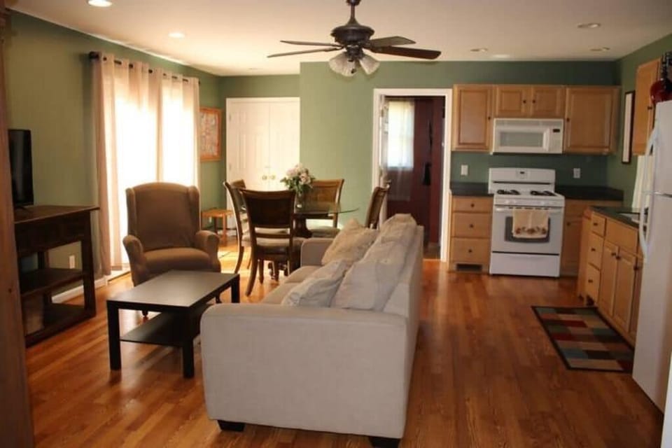 Living, kitchen, dining room combo...bathroom straight ahead, bedroom behind