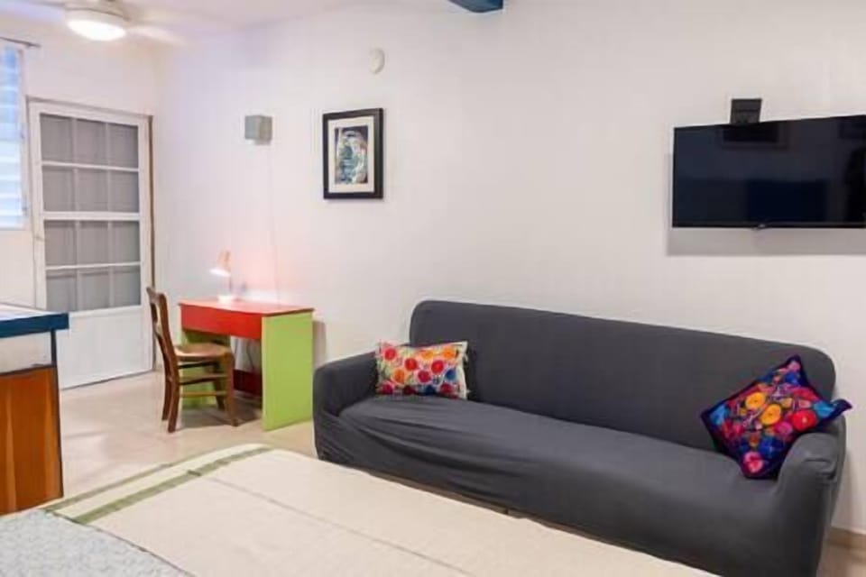 Sofa and small desk for working or eating. 
