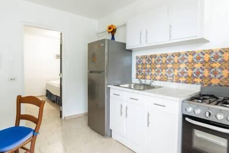 Full Kitchen with Fridge, Sink, and Stove