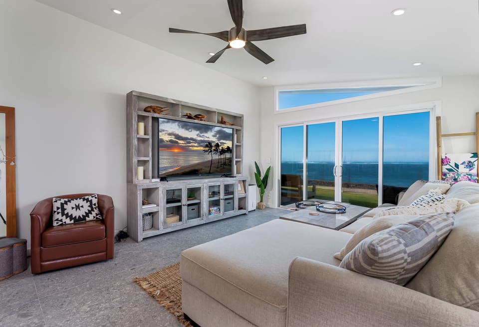 Comfortable living room with ocean view and smart TV