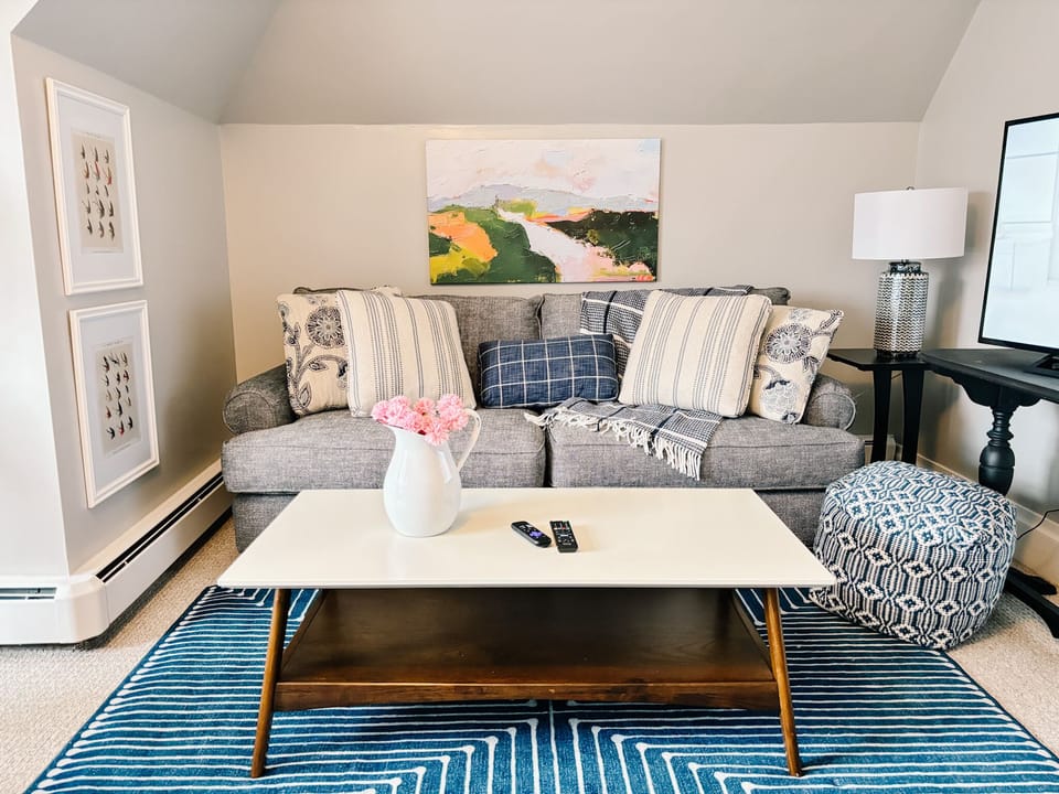 The 3rd floor living room includes a sleeper sofa. 