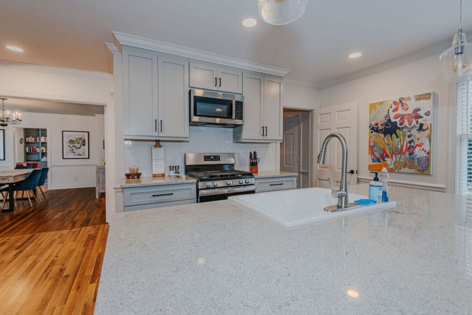 Kitchen equipped with: microwave, pots, pans, spices, dishware, silverware, cooking utensils, stove & oven, kettle, drip coffee machine, Keurig, french press, wine glasses, toaster, and more!