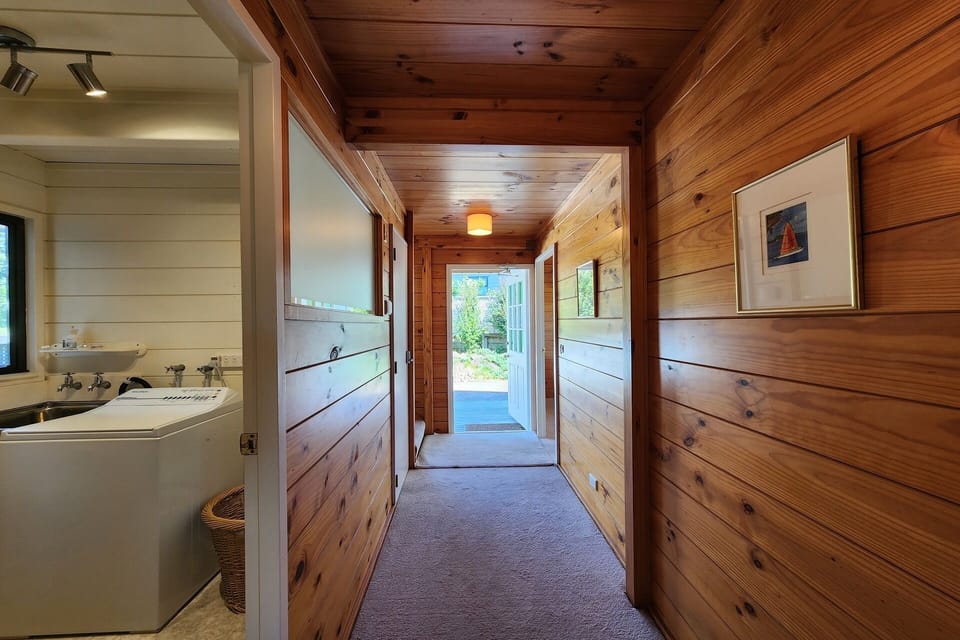 Hallway and laundry with washing machine