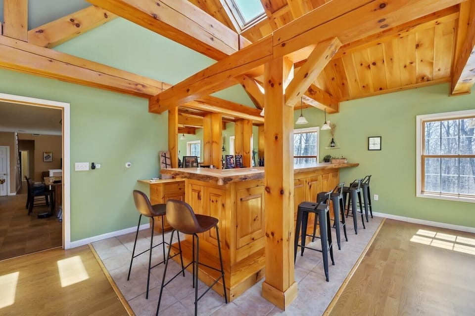 Custom built 15' Maple live edge bar top, with kegerator and tap.