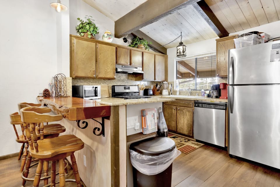 Open kitchen an breakfast bar which seats 3