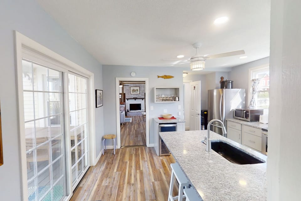 Open kitchen area with a dining island.