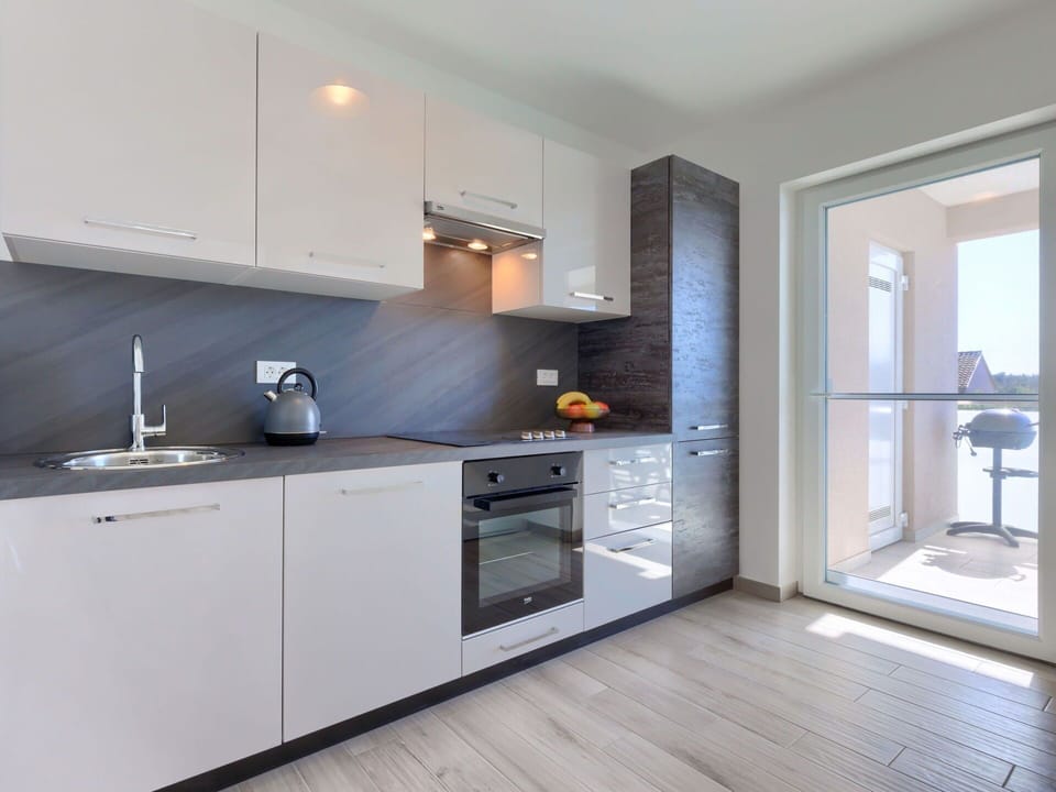 Cabinetry, Countertop, Property, Wood, Interior Design, Kitchen Stove, Kitchen, Floor, Flooring