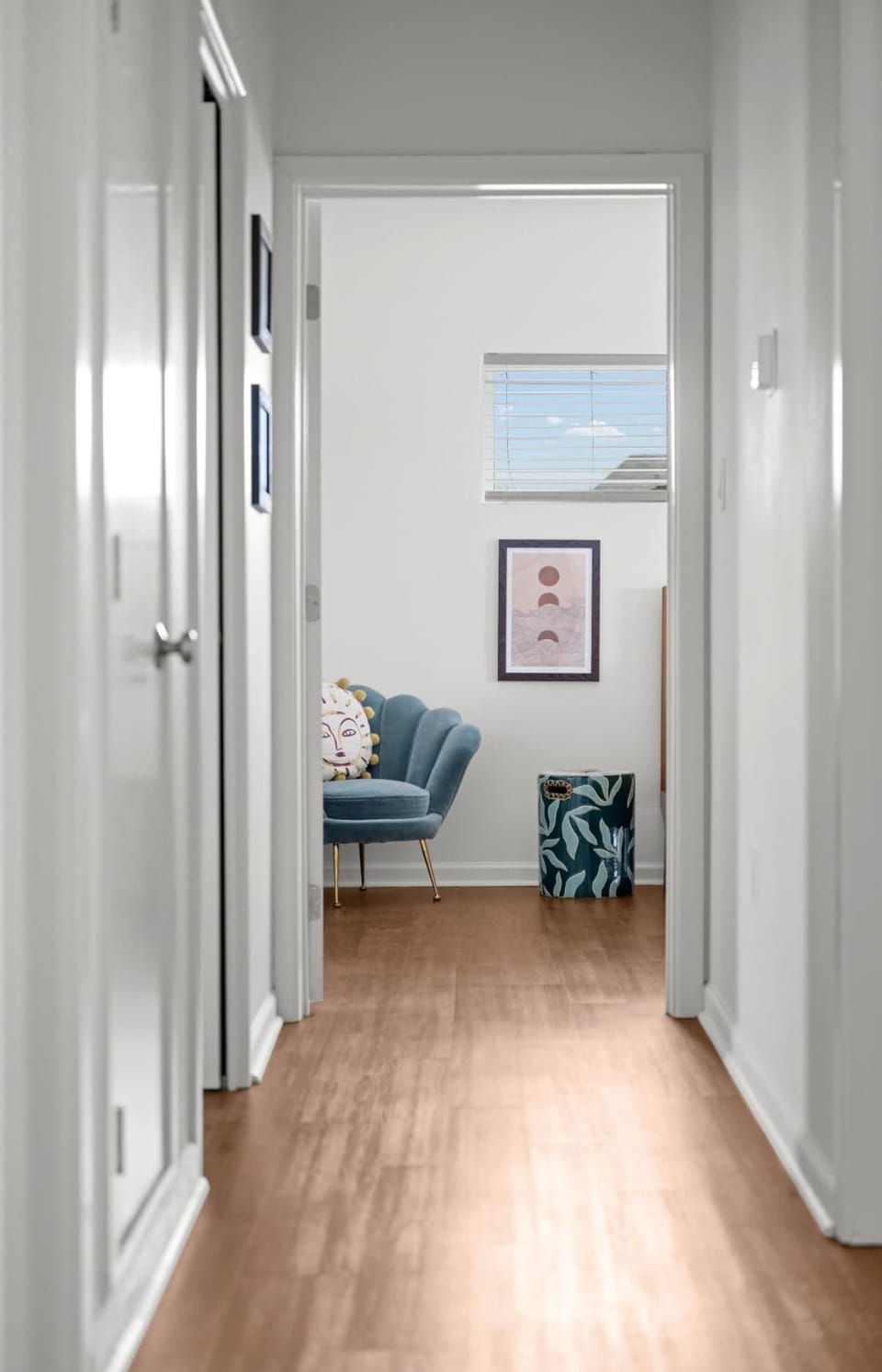 Hallway — Teal Scallop Chair & Moon Phase Art