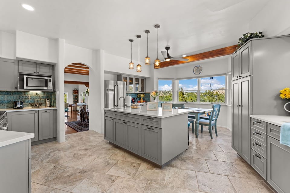 Gourmet kitchen with seating and views