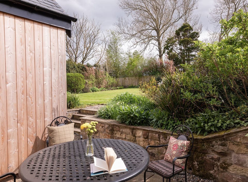 Pentland Cottage - outside dining space for four guests in the pretty rear garden