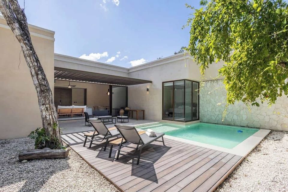 Pool connects to the main living room and one of the bedrooms