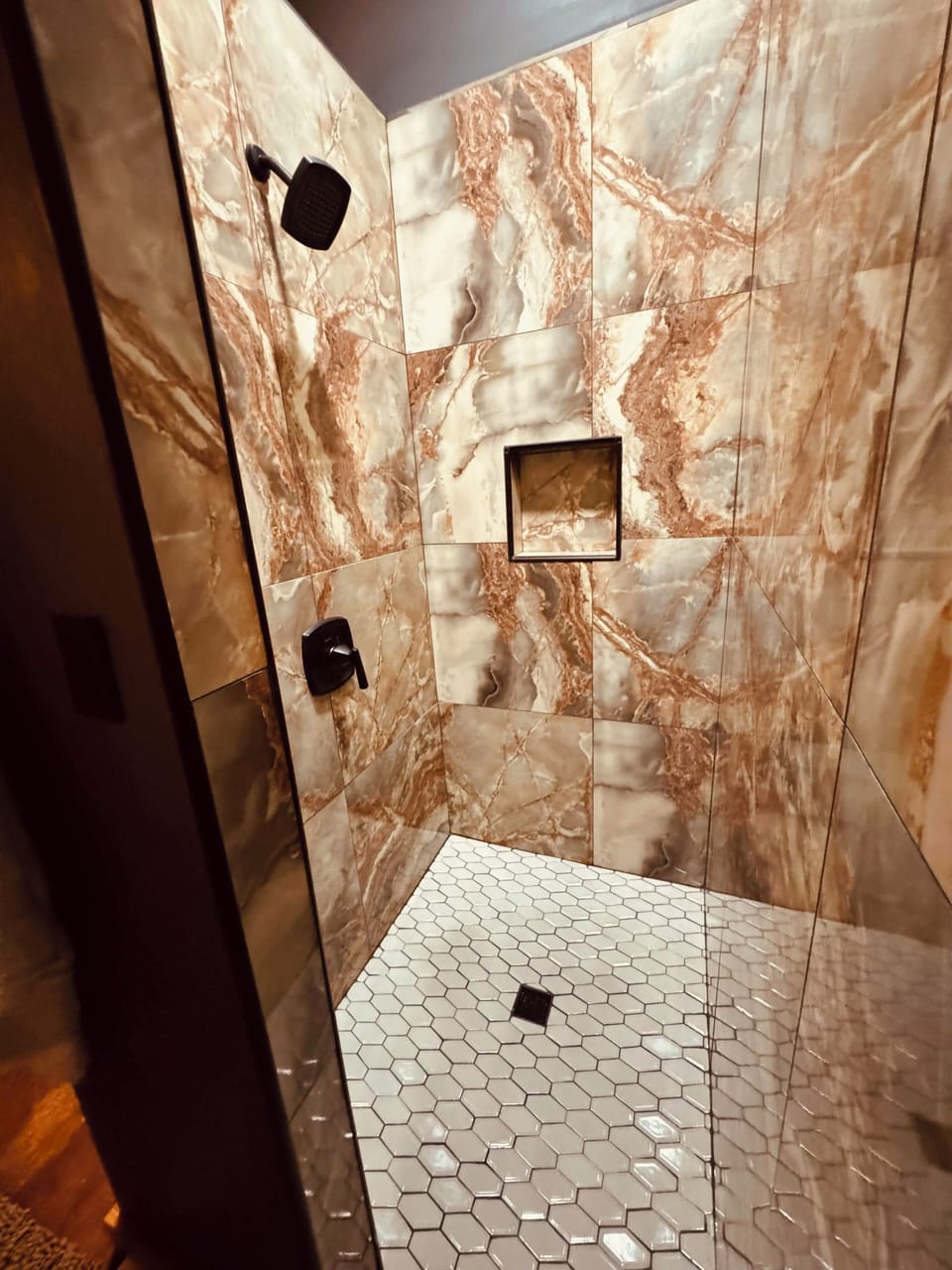 Custom tile shower in second full bathroom.
