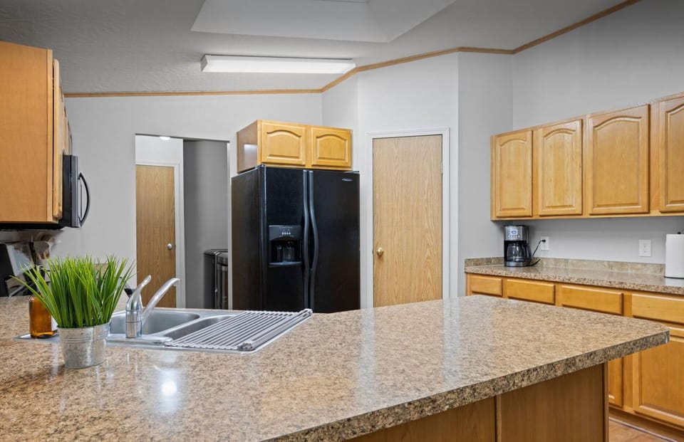 Plenty counter space, full fridge and walk-in pantry