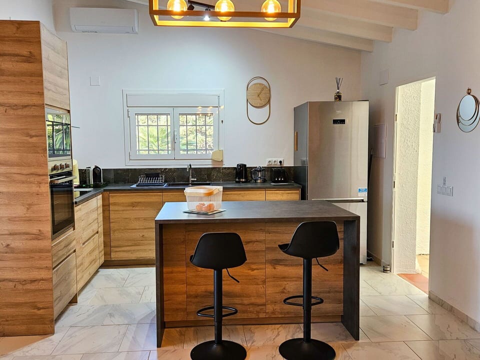 Table, Furniture, Property, Cabinetry, Chair, Countertop, Wood, Interior Design, Yellow, Building