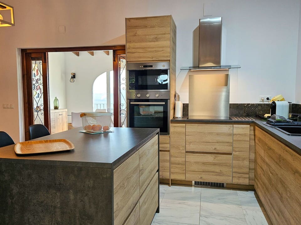 Cabinetry, Countertop, Property, Furniture, Kitchen Appliance, Building, Kitchen, Wood, Kitchen Stove, Home Appliance