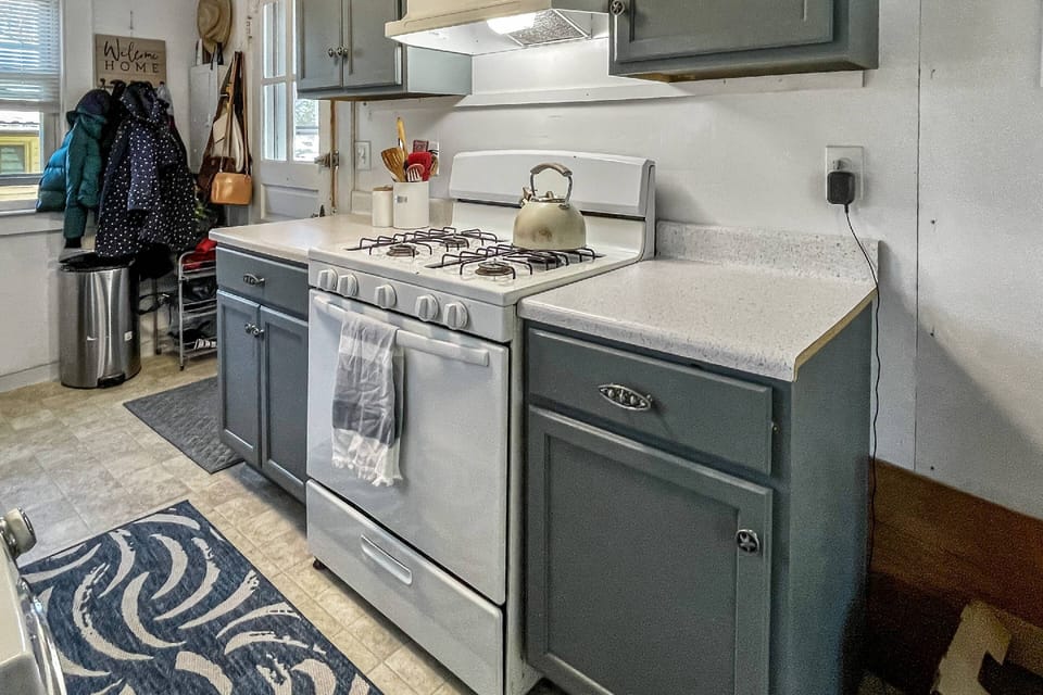 Kitchen leads out to back deck and grill area