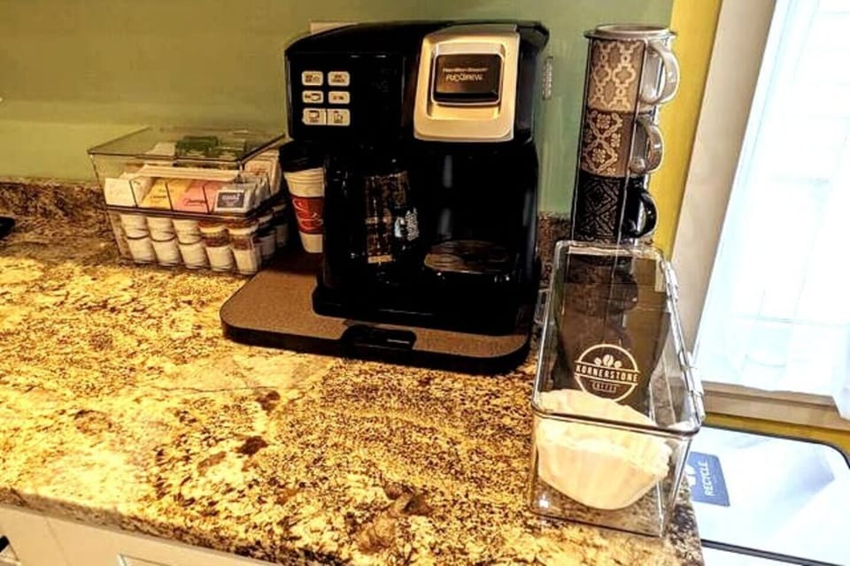 K-cup single serve or 12-cup coffee pot and an electric kettle. K-cups, tea and local coffee provided.
