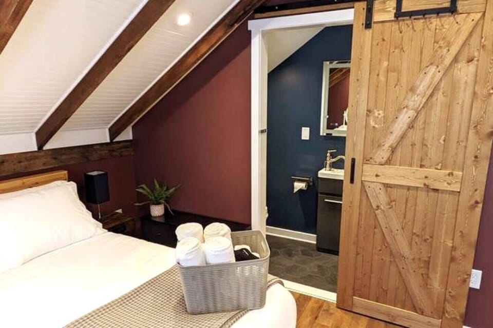 Rear Cottage Master Bedroom en suite bathroom sliding barn privacy door