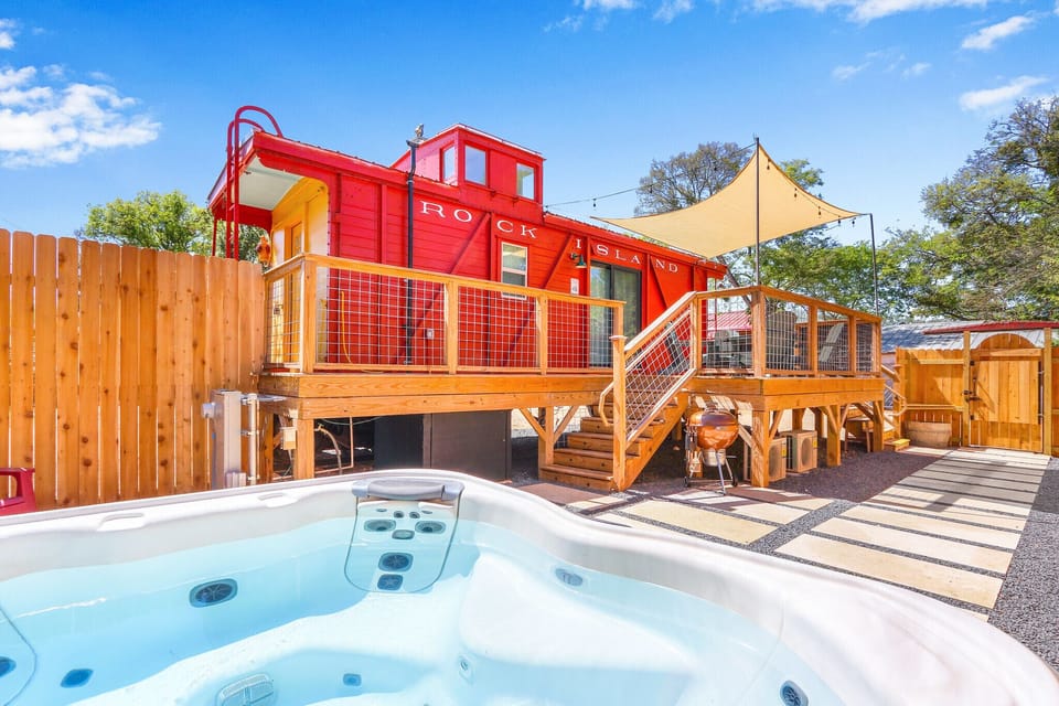 Private hot tub enclosed with privacy fence.