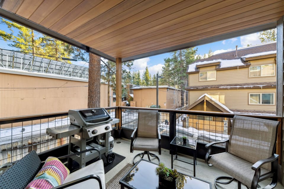 Unwind on your private covered balcony with comfortable seating and a BBQ grill, perfect for morning coffee or evening dining.