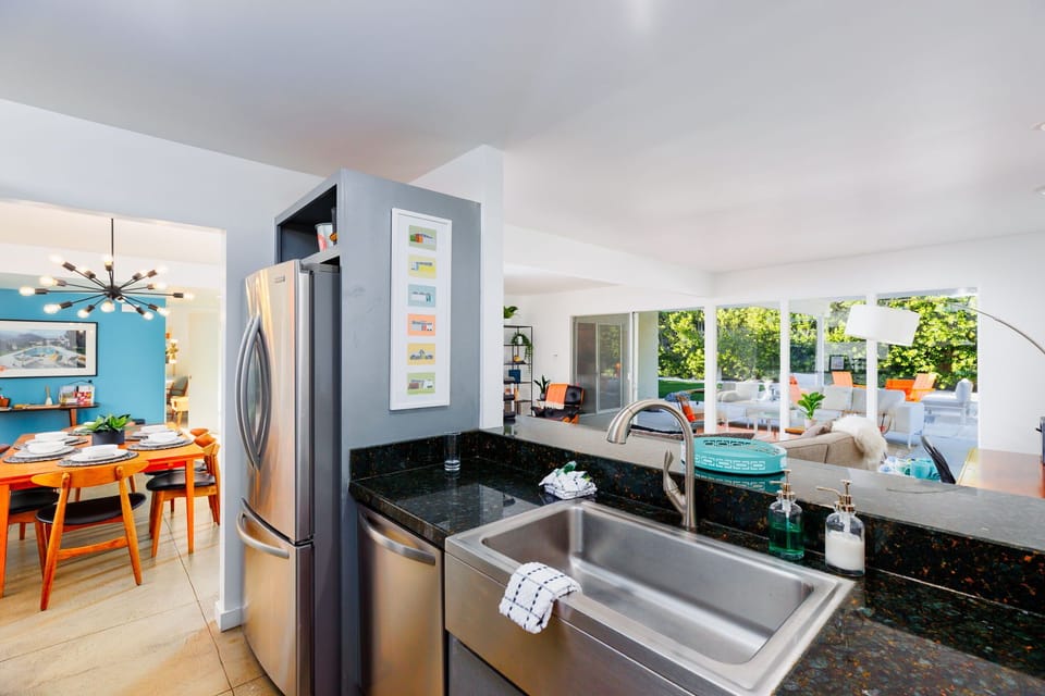 Spacious open-concept kitchen, dining, and living area designed for seamless living and entertaining.