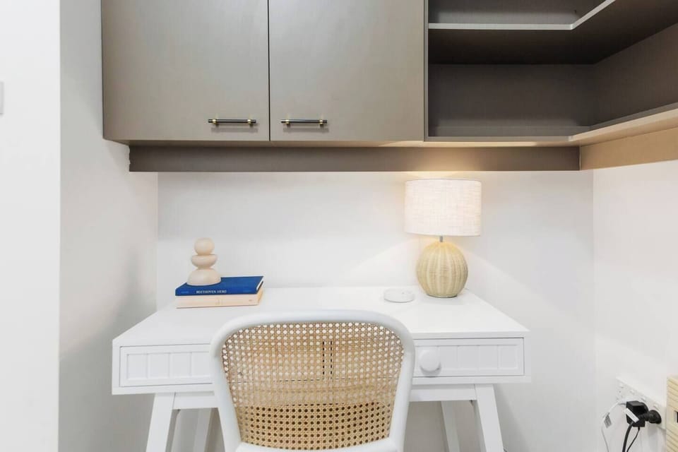 The fourth bedroom also doubles as a home office, with a deck and shelving.
