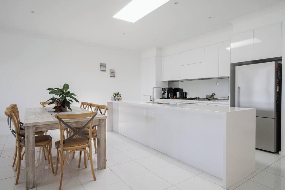 A large dining table makes it easy to share a meal at home, but you’ll also find plenty of eateries close by.
