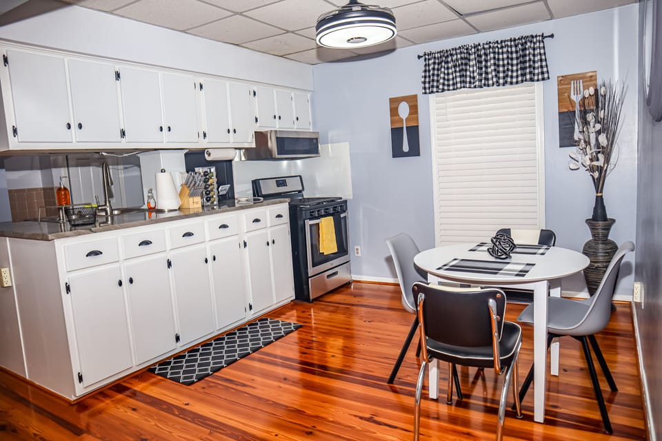 Behold the ideal kitchen and dining space, where the aroma fills the air.