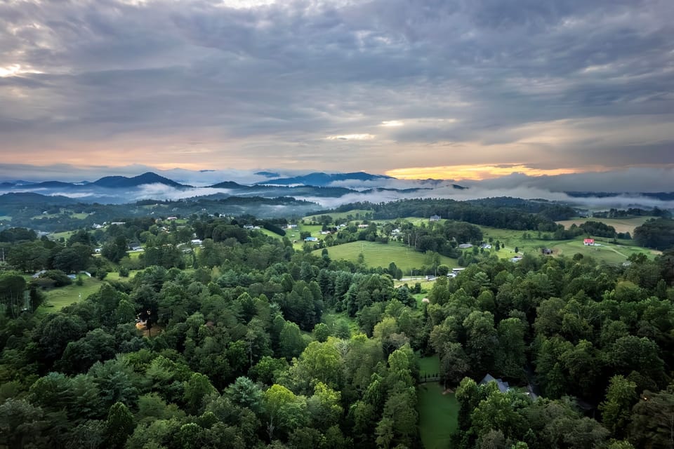 Beyond the treeline, you'll catch ridge after ridge of Blue Ridge Mountains stretching out. This is the view you came for.