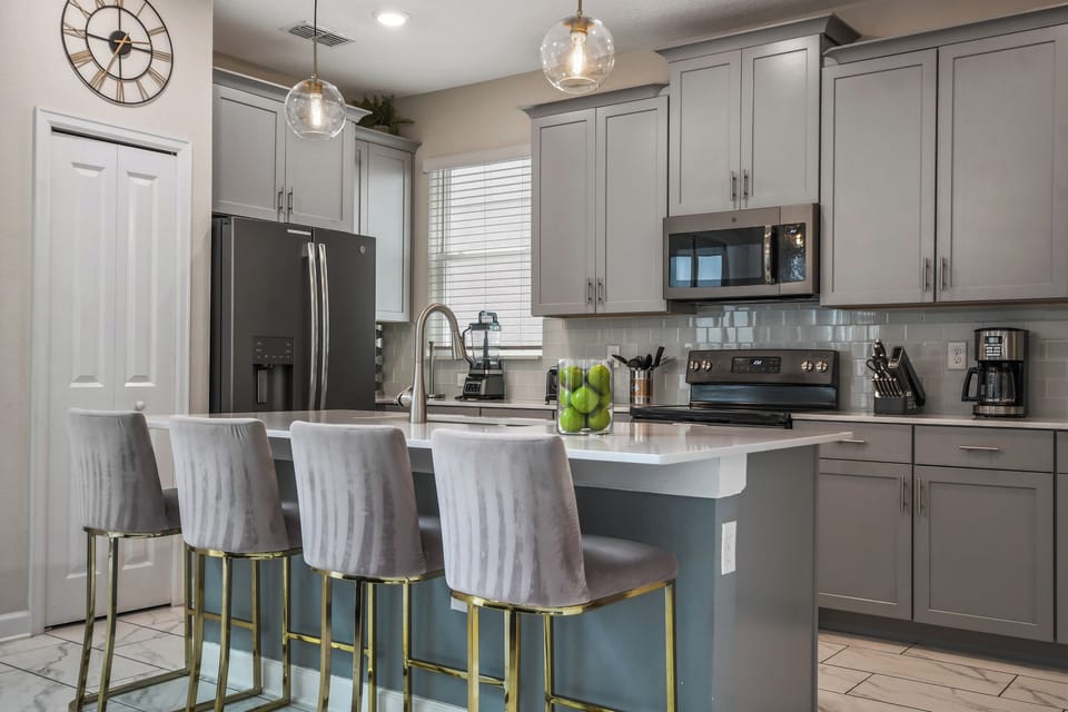 Large open kitchen stocked with amenities