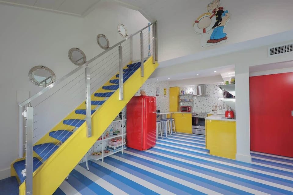 Bold yellow cabinetry gives the kitchen a cheerful, beachy pop fun and full of personality.
