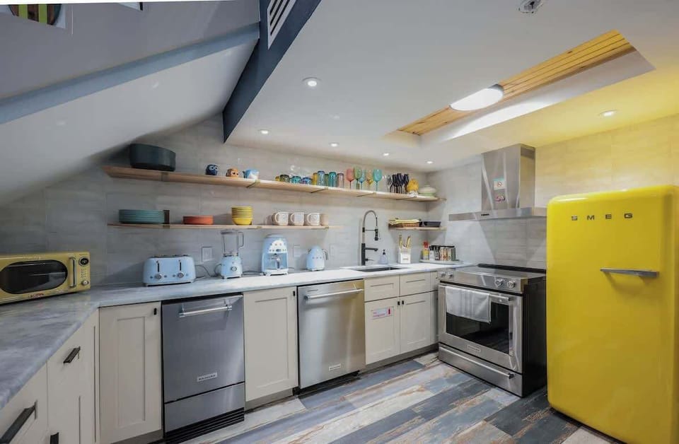 A designer kitchen that’s as functional as it is stunning  high-end finishes, bold style, and premium Smeg + KitchenAid appliances that make every meal feel elevated.