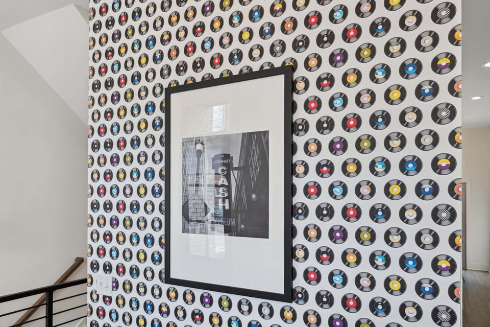 Vibrant, music-inspired wall art adds vintage charm to the space.