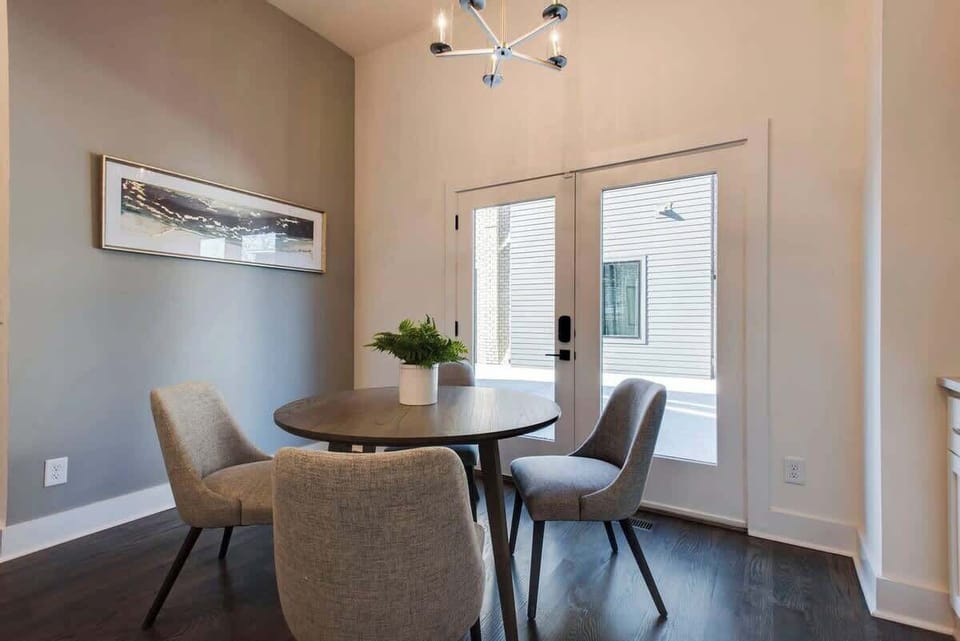 Cozy 4-seater dining space opening to the communal courtyard.