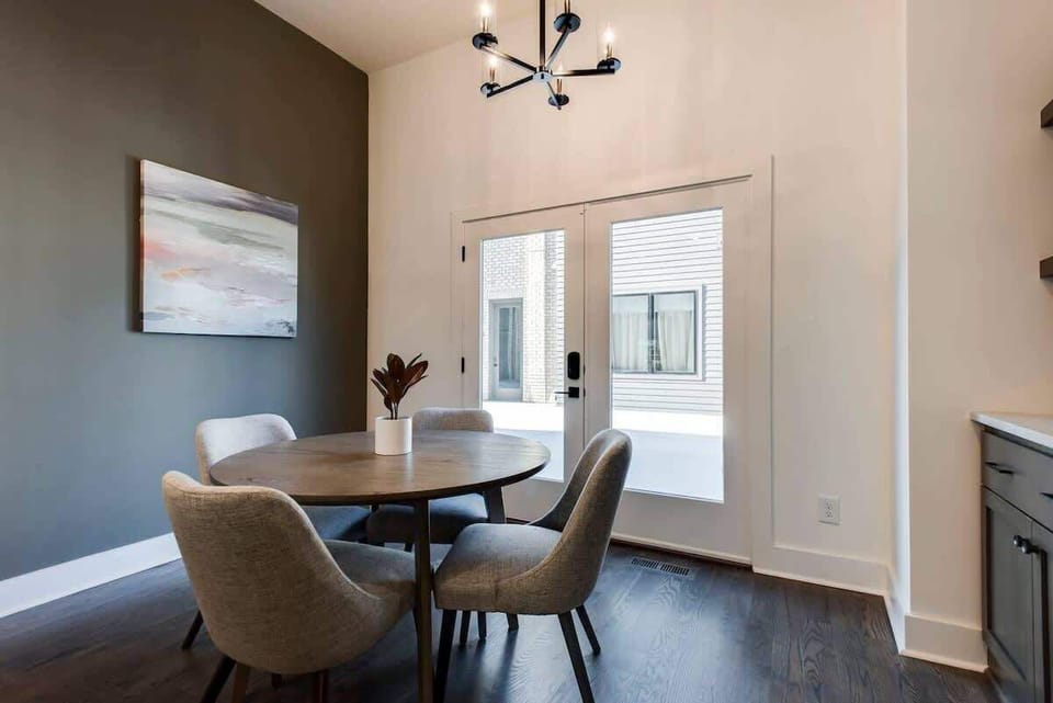Cute dining nook for four, brightened by natural light