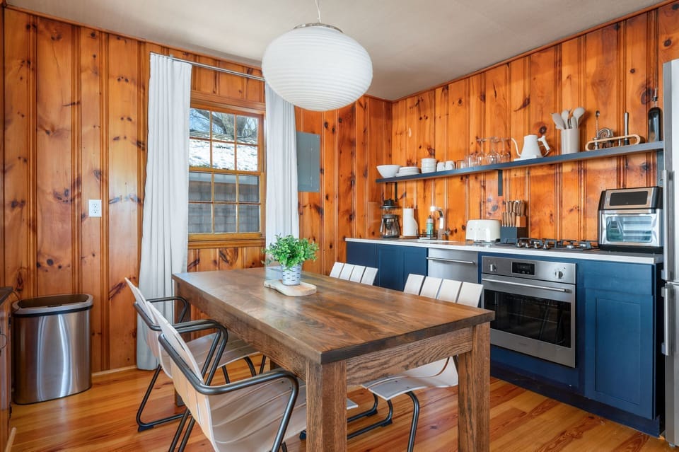 Encourage participation in preparing or serving meals on the nearby dining table