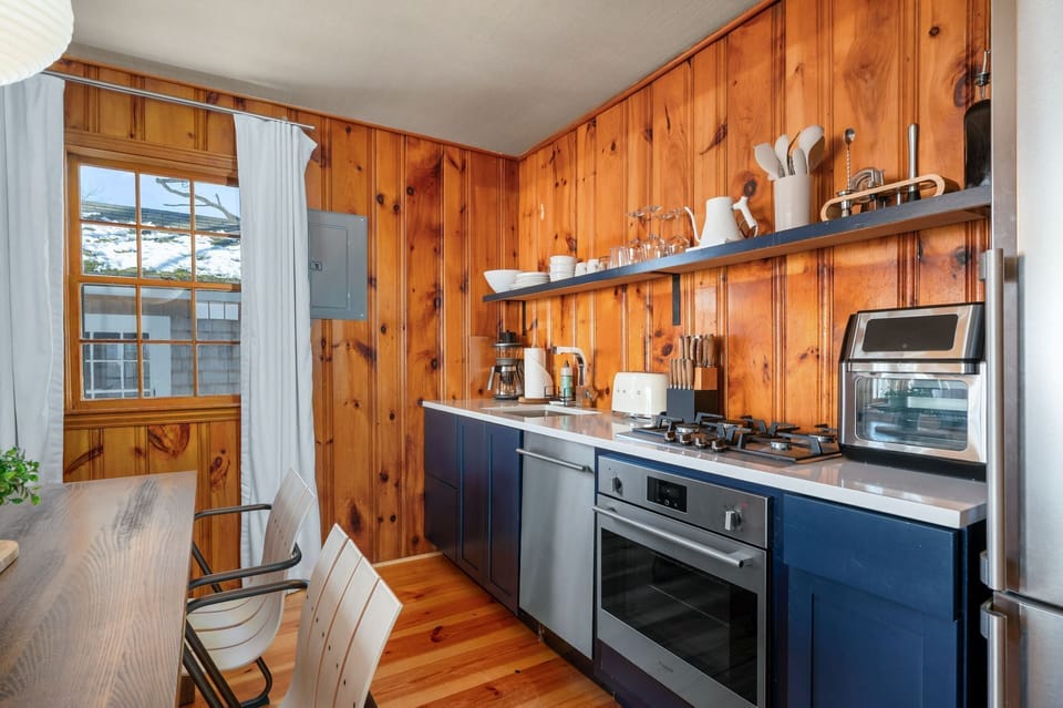 Open shelving and stainless steel appliances provide what you need for meal preparation -
